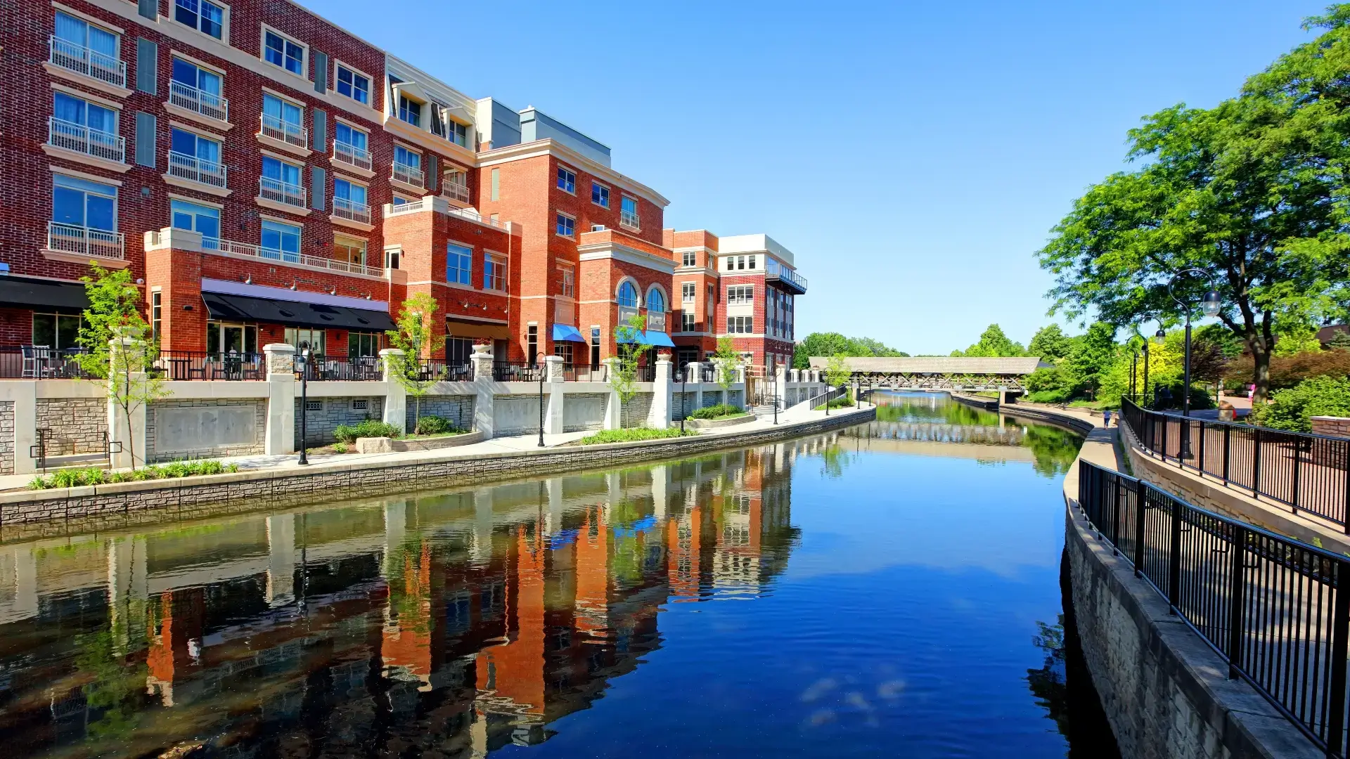 Downtown Naperville Riverwalk with scenic pathways, bridges, and the DuPage River. A top attraction for Naperville home residents.