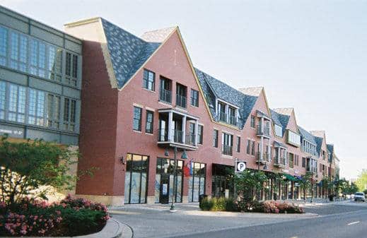 The Glen Town Center Glenview IL | MacLagan Home Loans Street level view of The Glen Town Center in Glenview IL showing the mixed-use retail and residential buildings along the main promenade